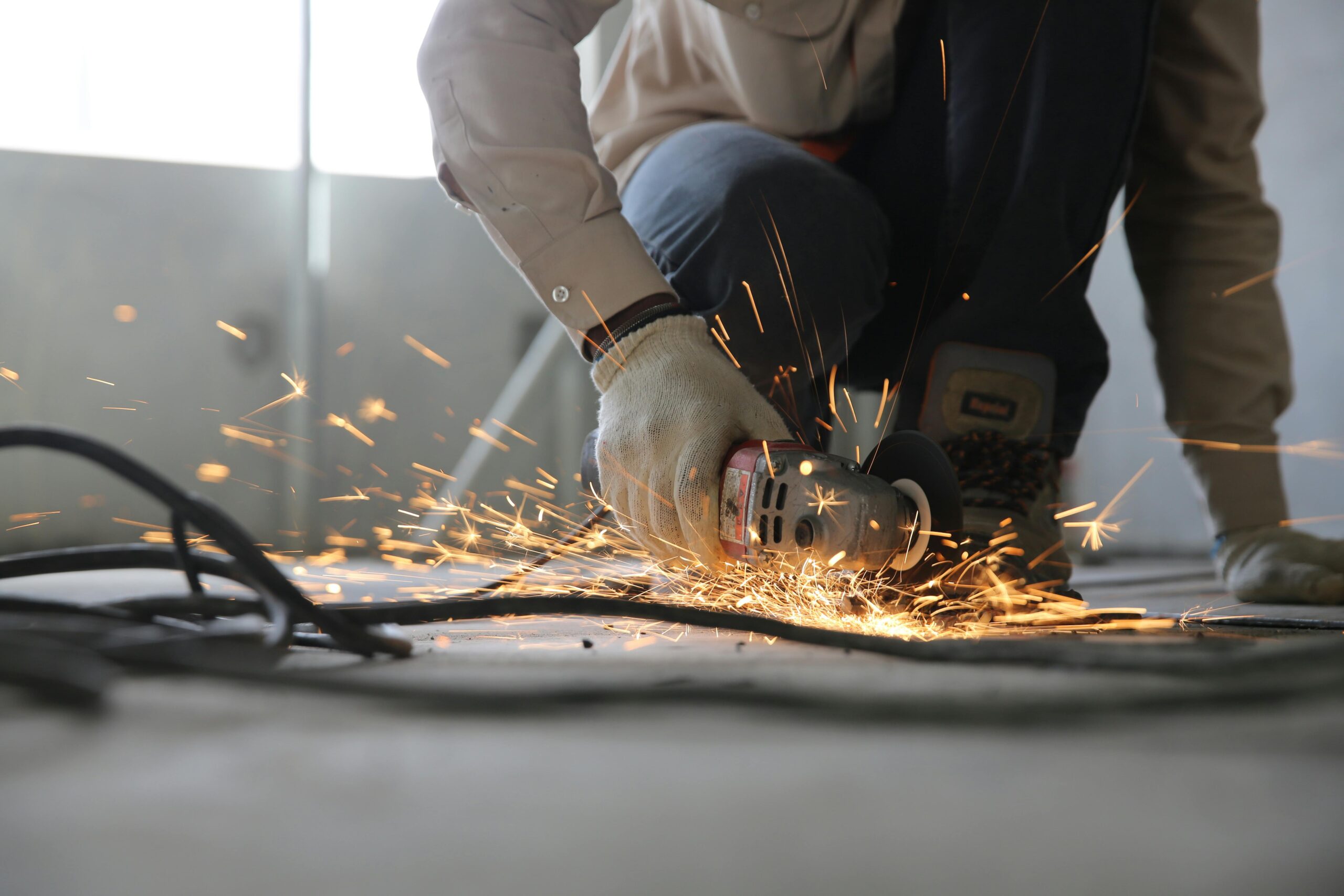 Construction Worker Cutting Metal